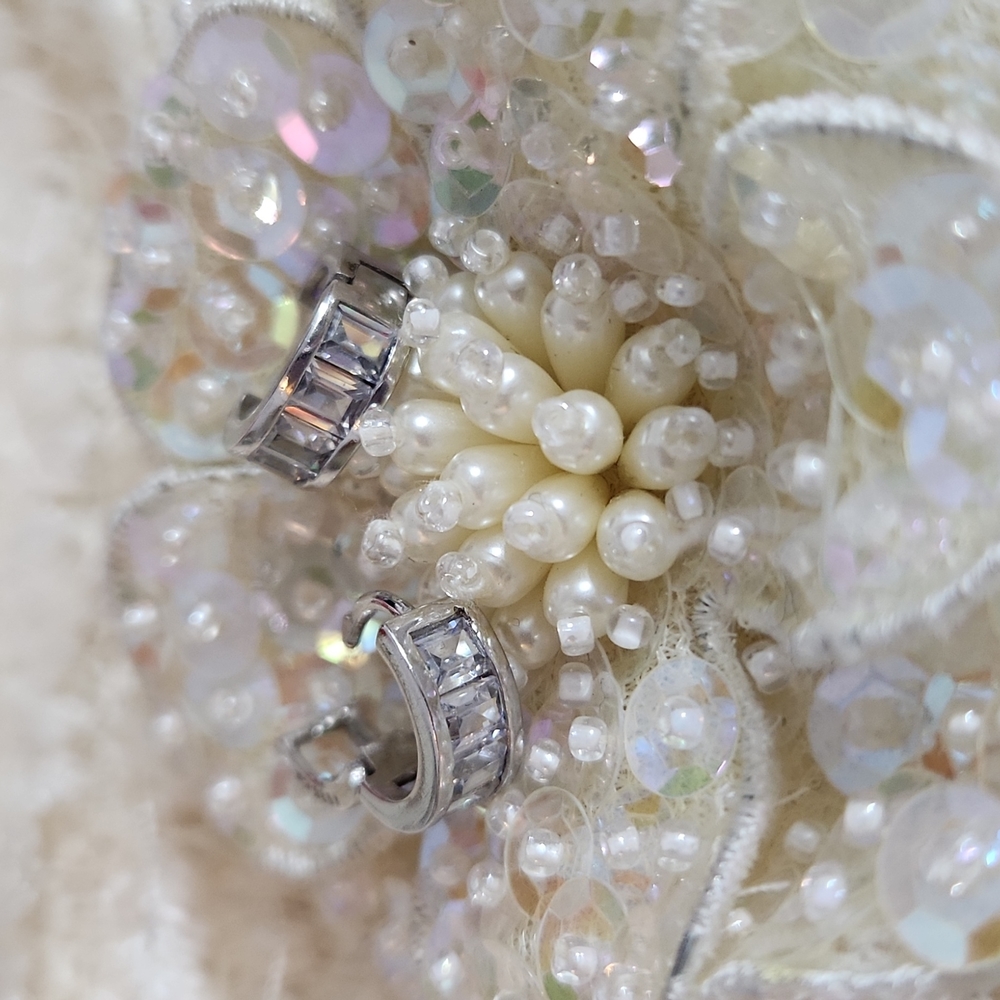 Earrings N 925 CN .5" each. Cubic Baguettes half way around